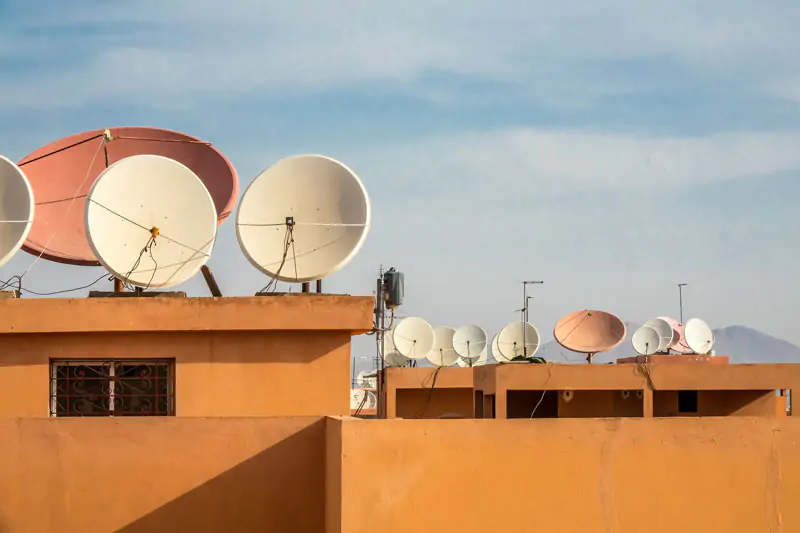 wide-angle-shot-white-satellite-dishes-roof-building-1.jpg